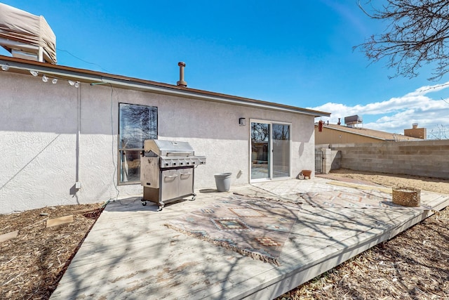 back of property with a patio area, fence, and stucco siding