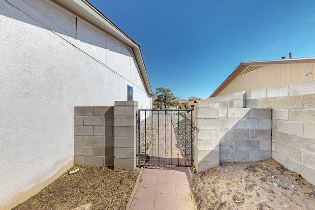 view of gate featuring fence