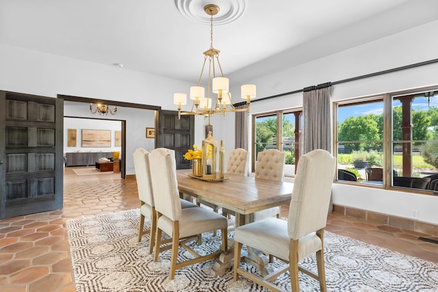 dining space featuring a chandelier