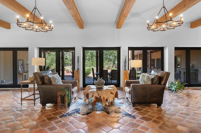 living room with an inviting chandelier, a towering ceiling, and beam ceiling