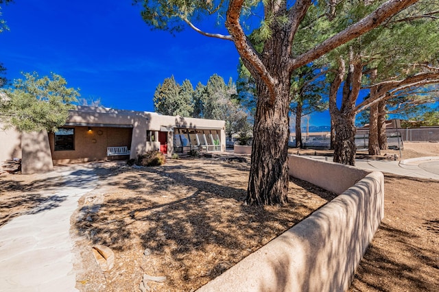 view of front of property featuring fence