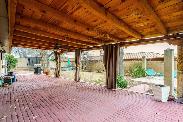 view of patio featuring fence, a ceiling fan, and area for grilling