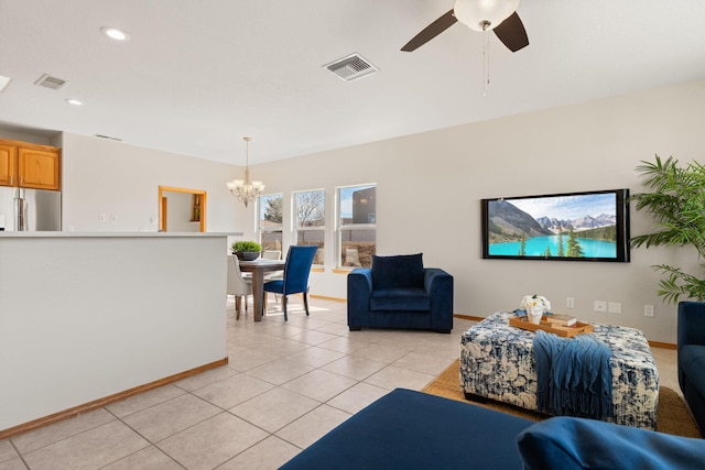 living area featuring light tile patterned floors, baseboards, and visible vents