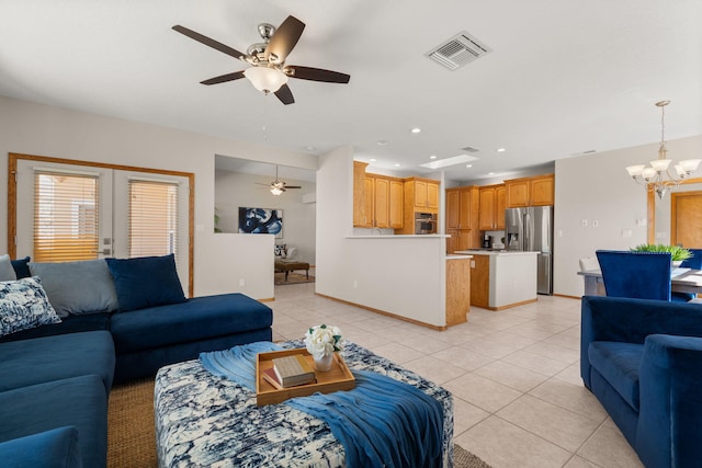 living room featuring recessed lighting, visible vents, baseboards, and light tile patterned floors