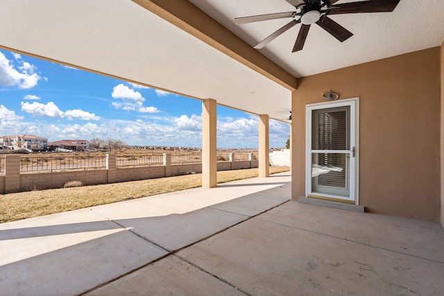 view of patio with a ceiling fan and a fenced backyard