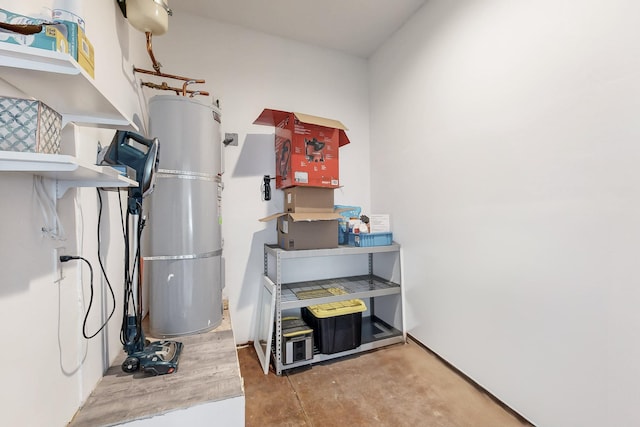 utility room featuring water heater