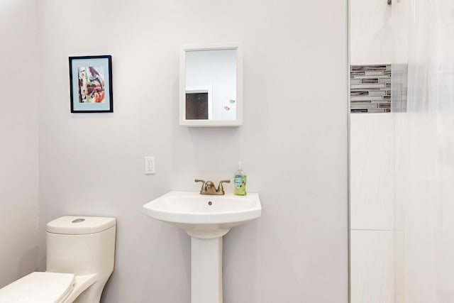 bathroom with a sink and toilet