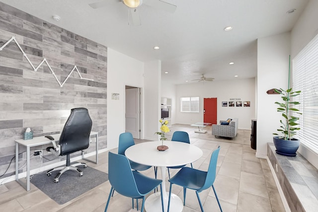 dining space featuring light tile patterned floors, an accent wall, a ceiling fan, and recessed lighting