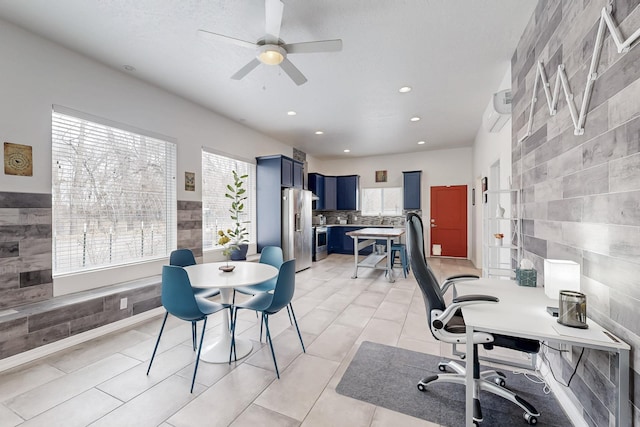 home office featuring a ceiling fan, recessed lighting, tile walls, and light tile patterned floors