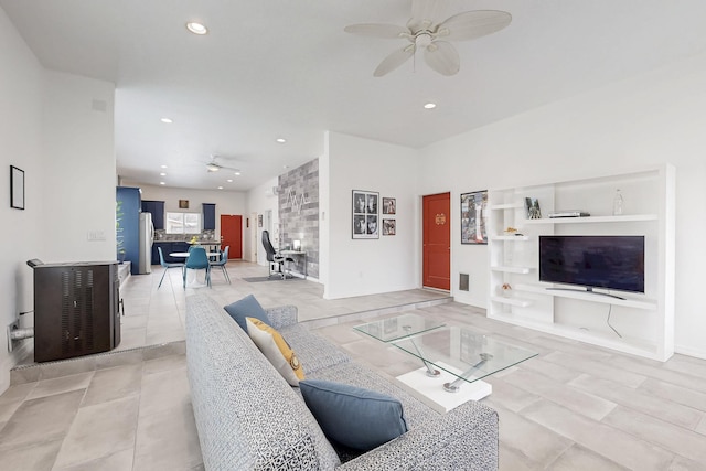 living area featuring light tile patterned floors, ceiling fan, and recessed lighting