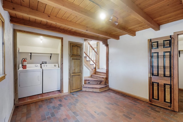 washroom featuring brick floor, wood ceiling, laundry area, and separate washer and dryer