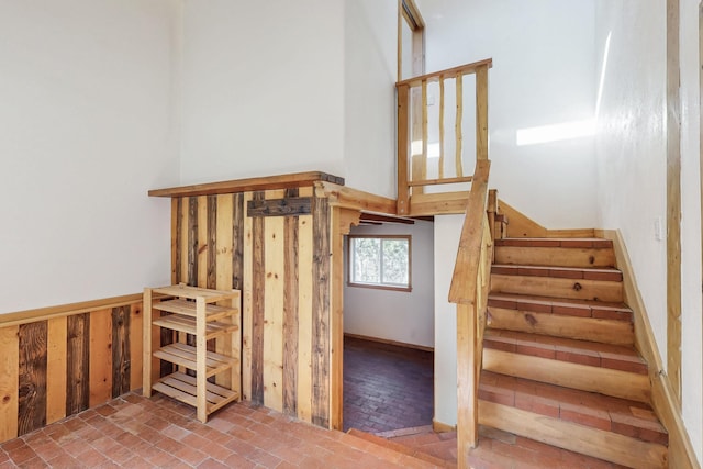 stairs featuring brick floor