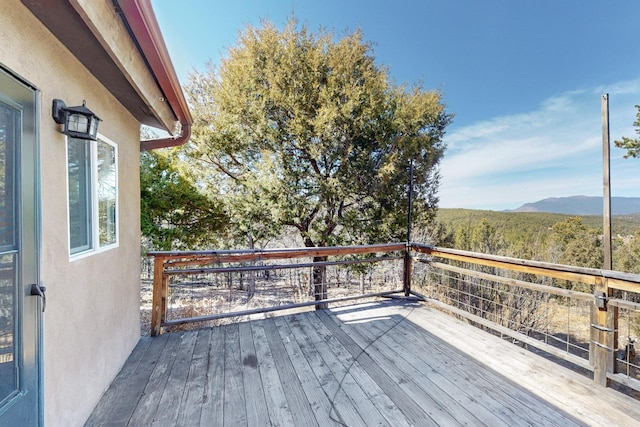 wooden deck featuring a mountain view