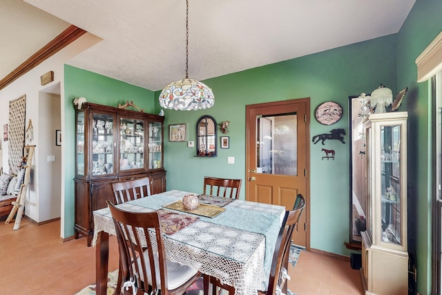 dining space featuring baseboards