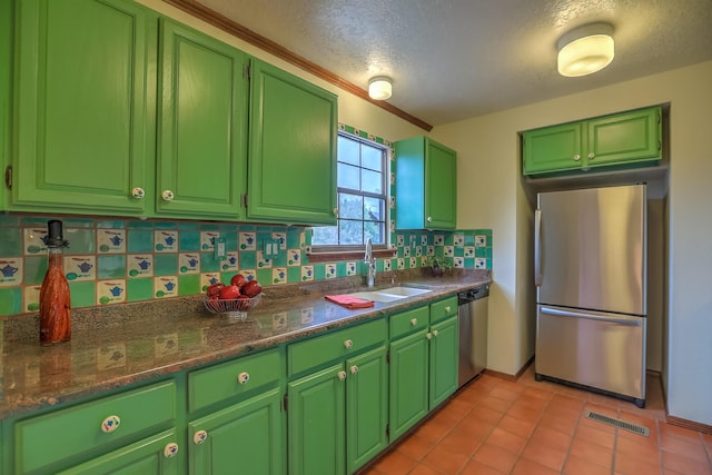 kitchen featuring light tile patterned floors, tasteful backsplash, visible vents, appliances with stainless steel finishes, and a sink