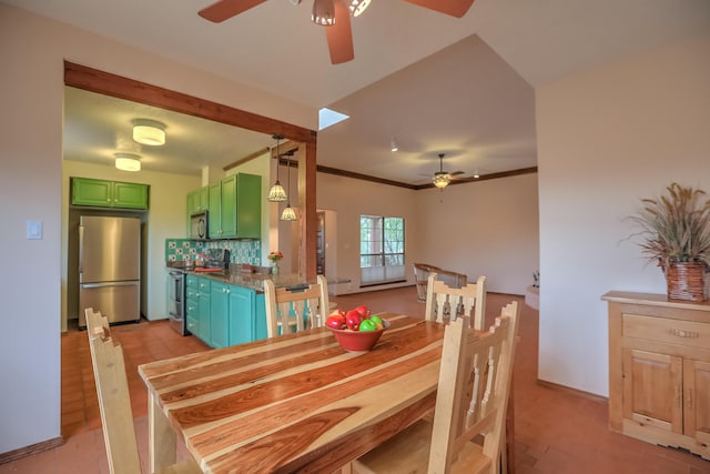 dining area featuring baseboards, a ceiling fan, and crown molding