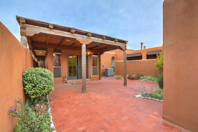 view of patio / terrace with fence and central AC