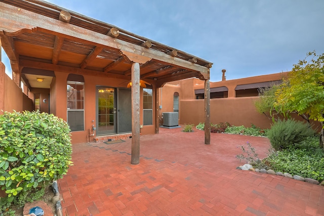 view of patio / terrace featuring fence and central air condition unit