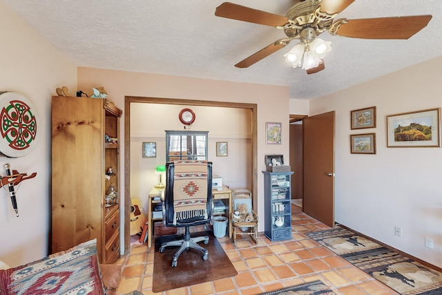 office area featuring ceiling fan and a textured ceiling