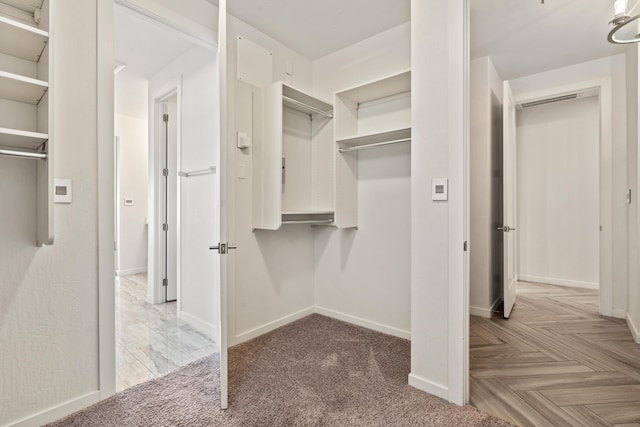 walk in closet with visible vents