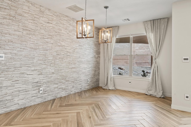 unfurnished dining area with a wealth of natural light, baseboards, visible vents, and a notable chandelier