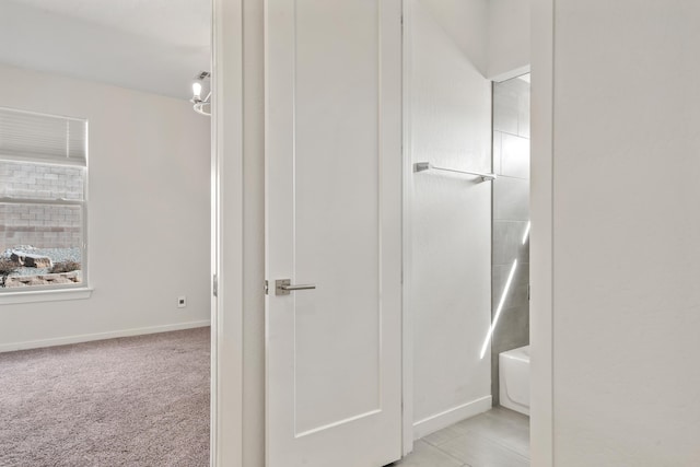 full bathroom with washtub / shower combination and baseboards