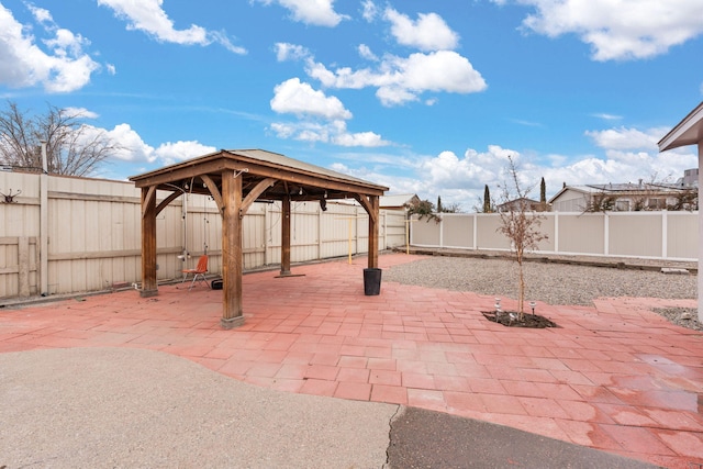 view of patio / terrace with a fenced backyard and a gazebo