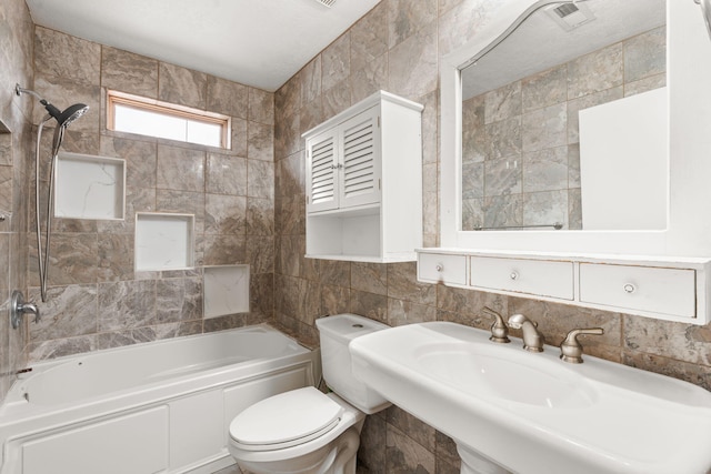 full bathroom with tile walls, bathing tub / shower combination, visible vents, decorative backsplash, and toilet