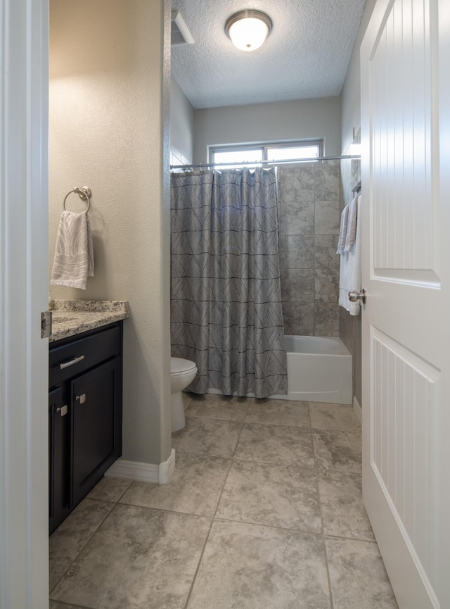 full bathroom featuring a textured ceiling, tile patterned flooring, toilet, vanity, and shower / bath combo with shower curtain