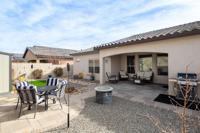 view of patio / terrace featuring outdoor dining space, outdoor lounge area, fence, and grilling area