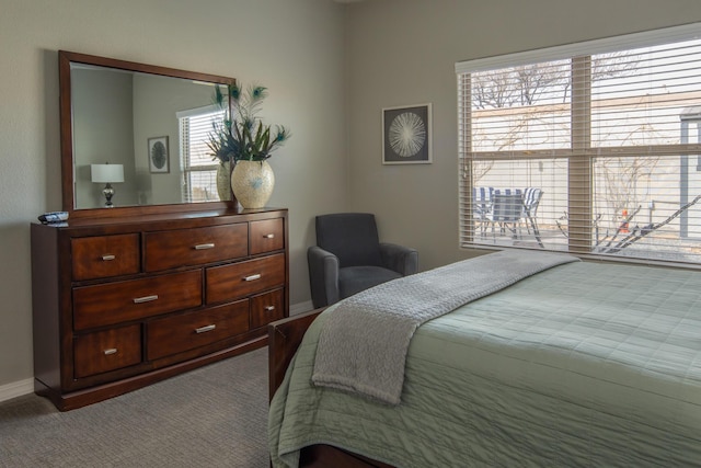 bedroom with carpet flooring and baseboards