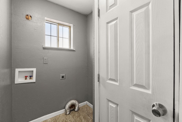 laundry room featuring washer hookup, a textured wall, electric dryer hookup, laundry area, and baseboards