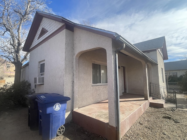 view of home's exterior with a patio area, cooling unit, and stucco siding