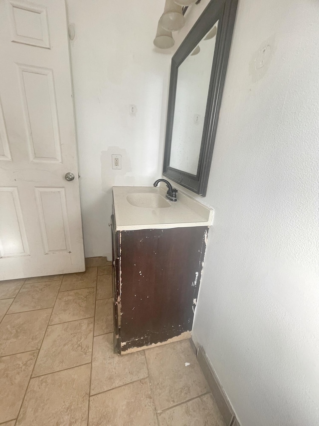 bathroom featuring vanity and baseboards