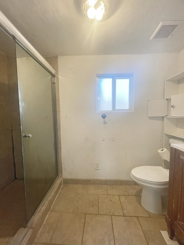 full bath featuring visible vents, toilet, a shower stall, and vanity