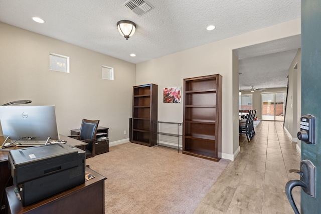 carpeted home office featuring recessed lighting, visible vents, a textured ceiling, and baseboards