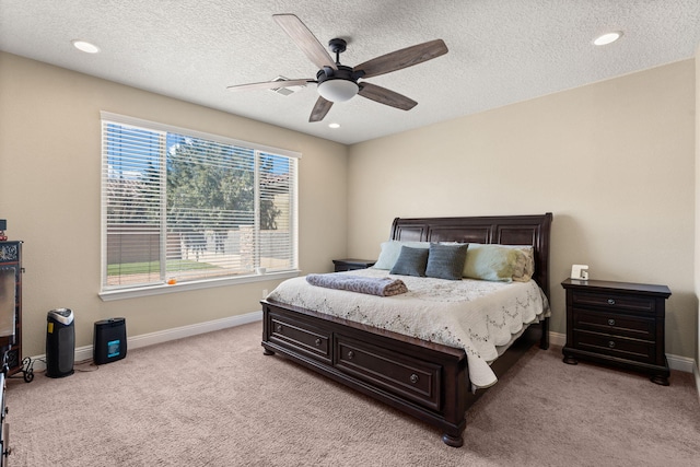 bedroom with light carpet, a ceiling fan, and baseboards