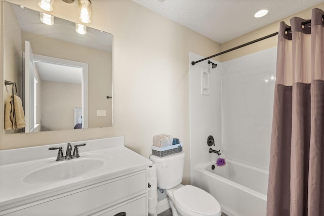 full bath featuring toilet, a textured ceiling, vanity, and shower / bathtub combination with curtain