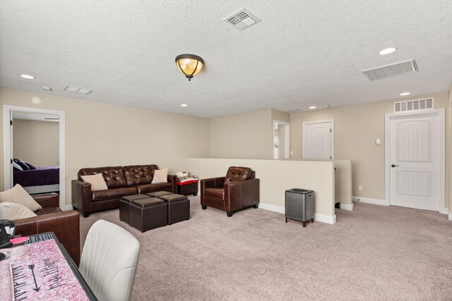 living room featuring light carpet, visible vents, and baseboards