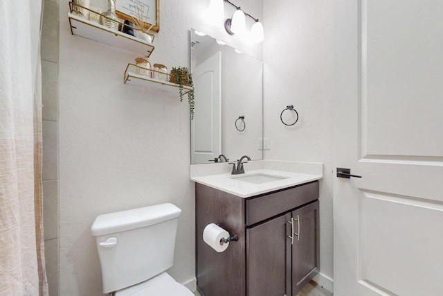 full bath with vanity and toilet