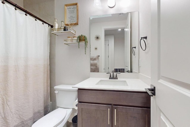 bathroom with toilet, shower / tub combo, visible vents, and vanity