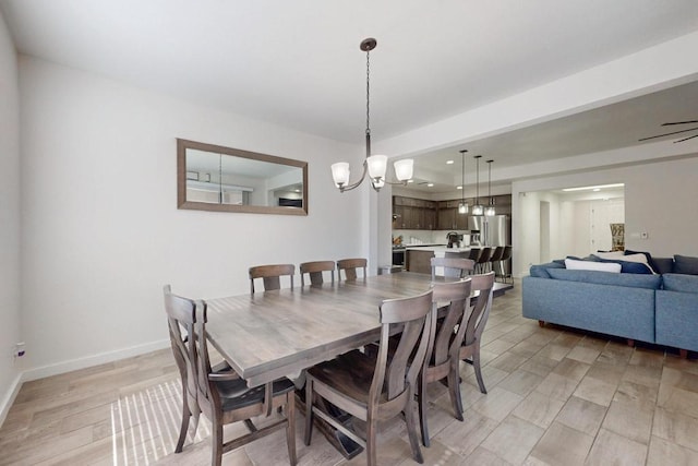 dining space featuring recessed lighting, light wood-type flooring, and baseboards