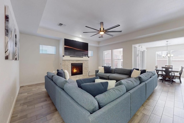 living area featuring a healthy amount of sunlight, visible vents, and a fireplace