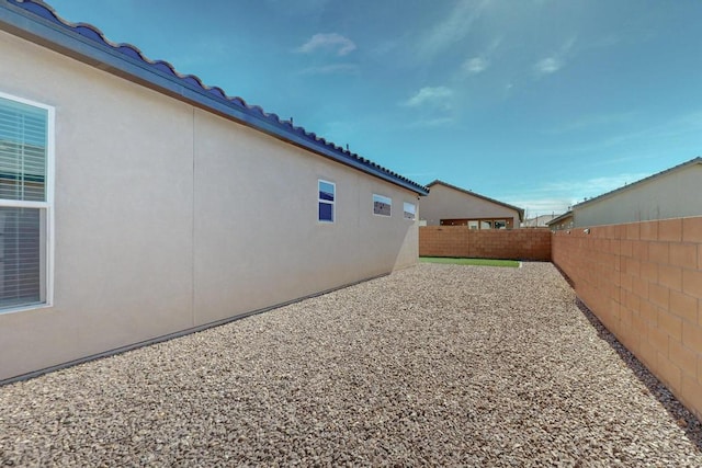 view of yard featuring a patio area and a fenced backyard