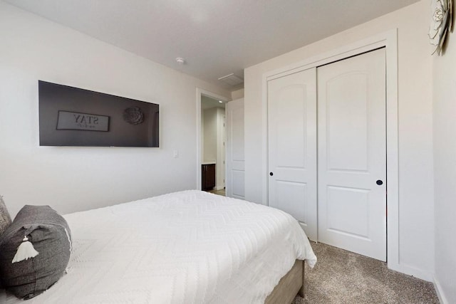 bedroom with carpet and a closet