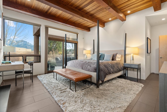 bedroom with wooden ceiling, a mountain view, and beam ceiling