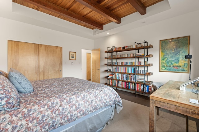 bedroom with wood ceiling, a closet, and beamed ceiling