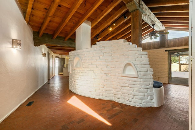 hall featuring brick floor, wooden ceiling, visible vents, and vaulted ceiling with beams