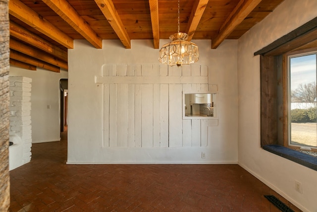 unfurnished room featuring brick floor, wooden ceiling, visible vents, beamed ceiling, and an inviting chandelier