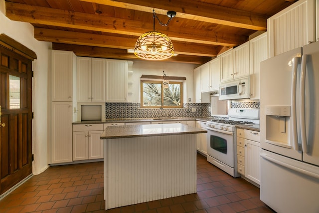 kitchen with white appliances, white cabinetry, hanging light fixtures, beam ceiling, and tasteful backsplash